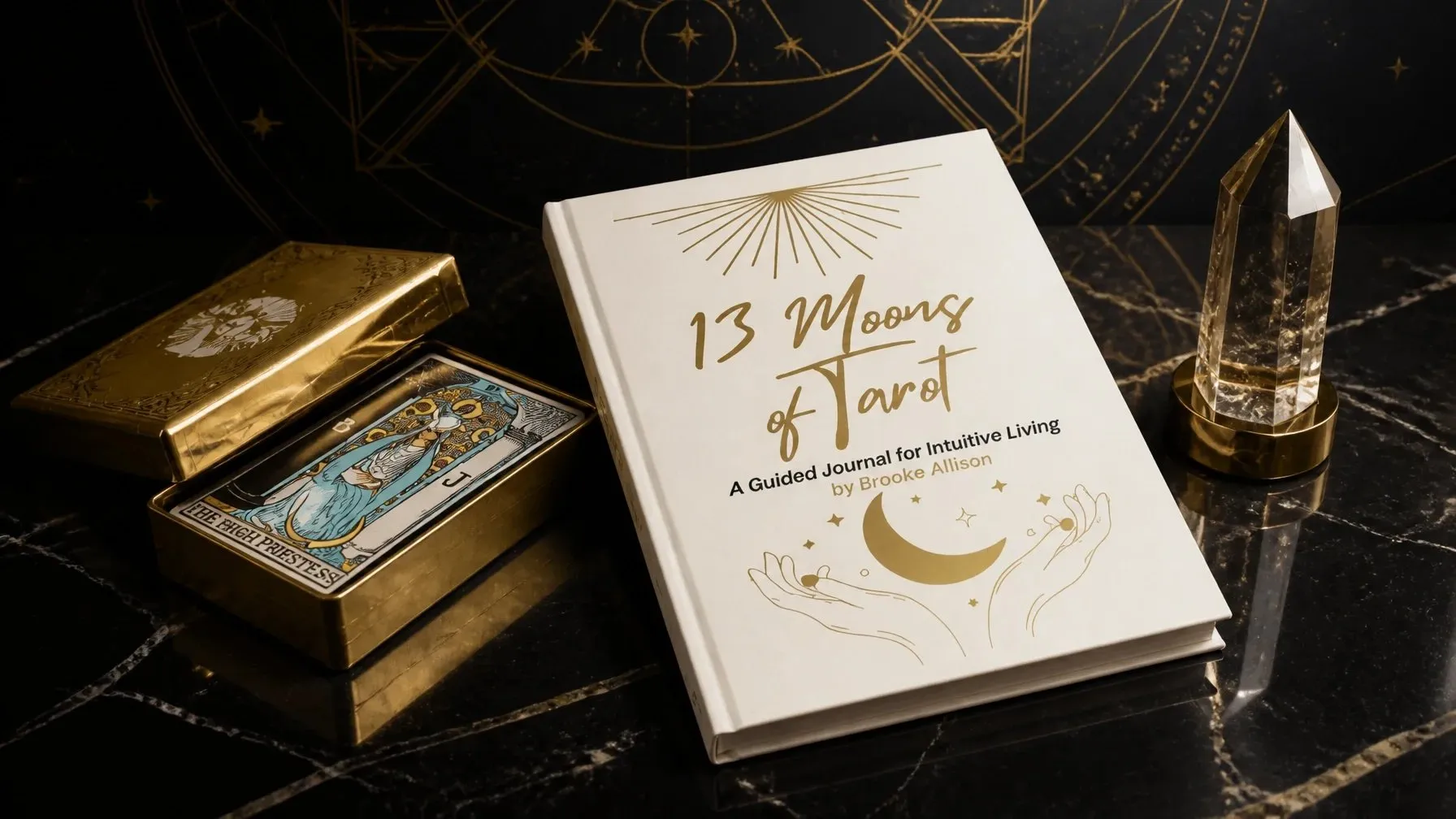 The 13 Moons of Tarot guided journal beside a clear crystal